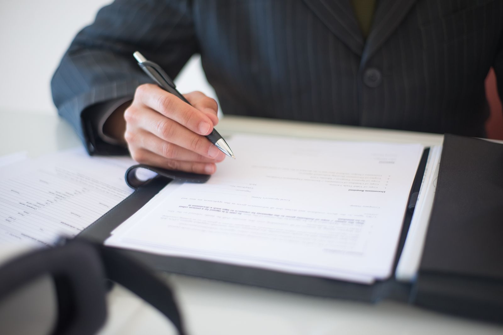Attorney signing legal documents